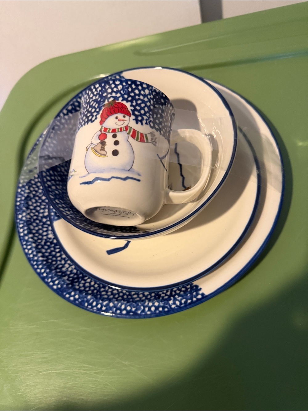four-piece place setting from the retired Snowman collection by Thomson Pottery,